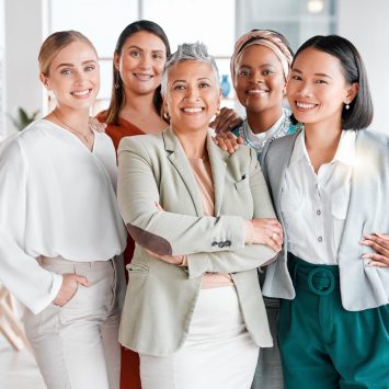 Female Coaches empowerment for office leadership. Career hug and solidarity of asian, black woman and senior people or employees at global company.